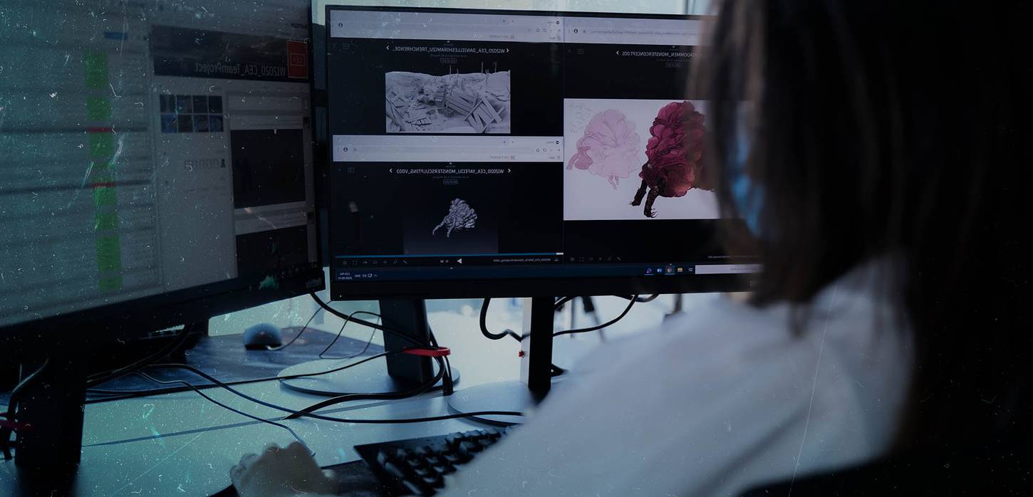 3D animation student working on a 3D modelling project on a computer