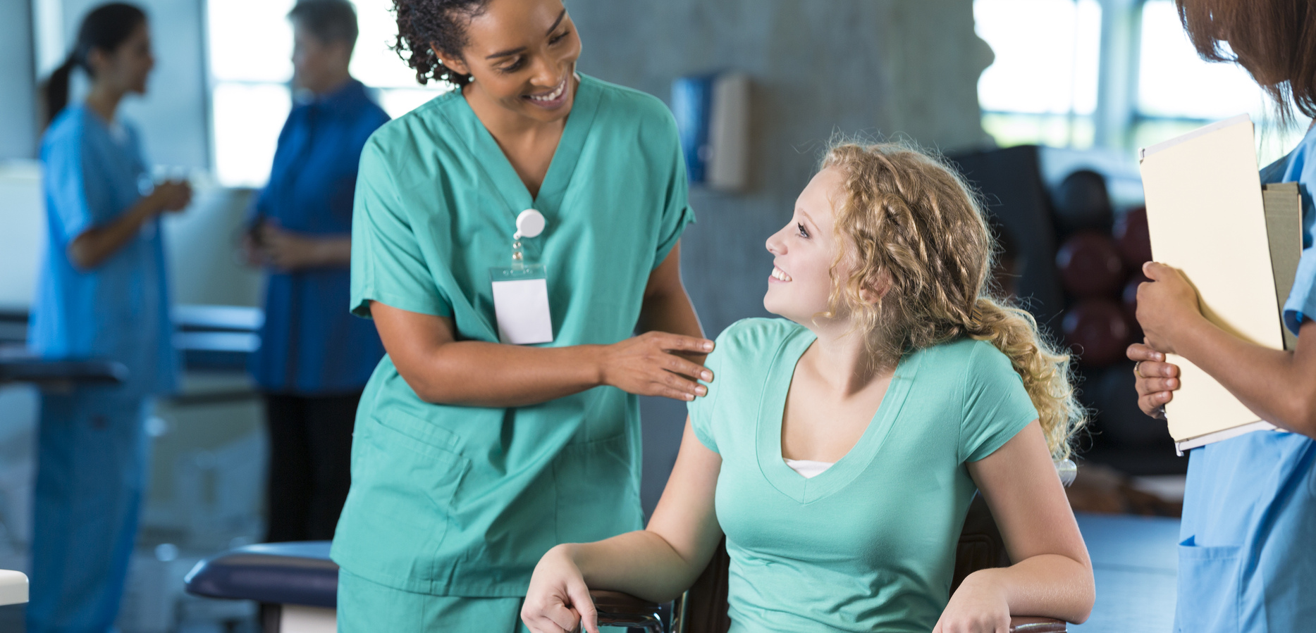 Therapy aide assistant helping a patient