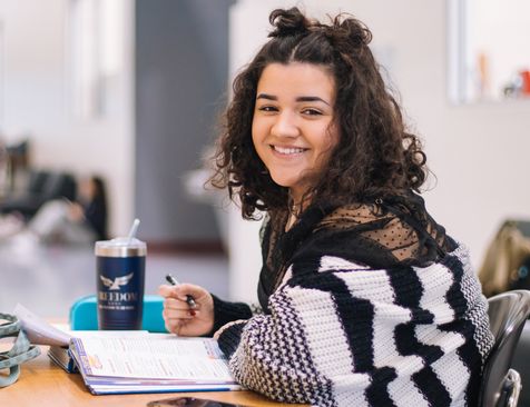 Student working at classroom desk