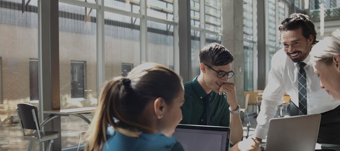 Research team meeting at computers