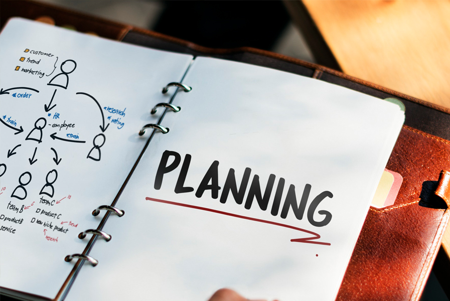 A notebook or planner open to a page that reads "planning"